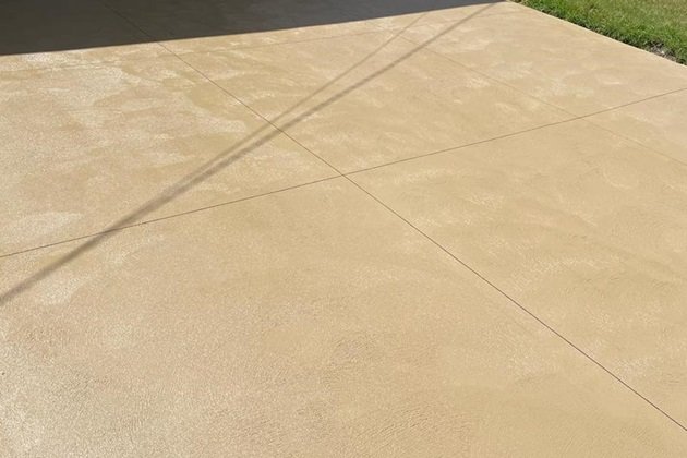 Outdoor patio featuring earth-tone coloured concrete