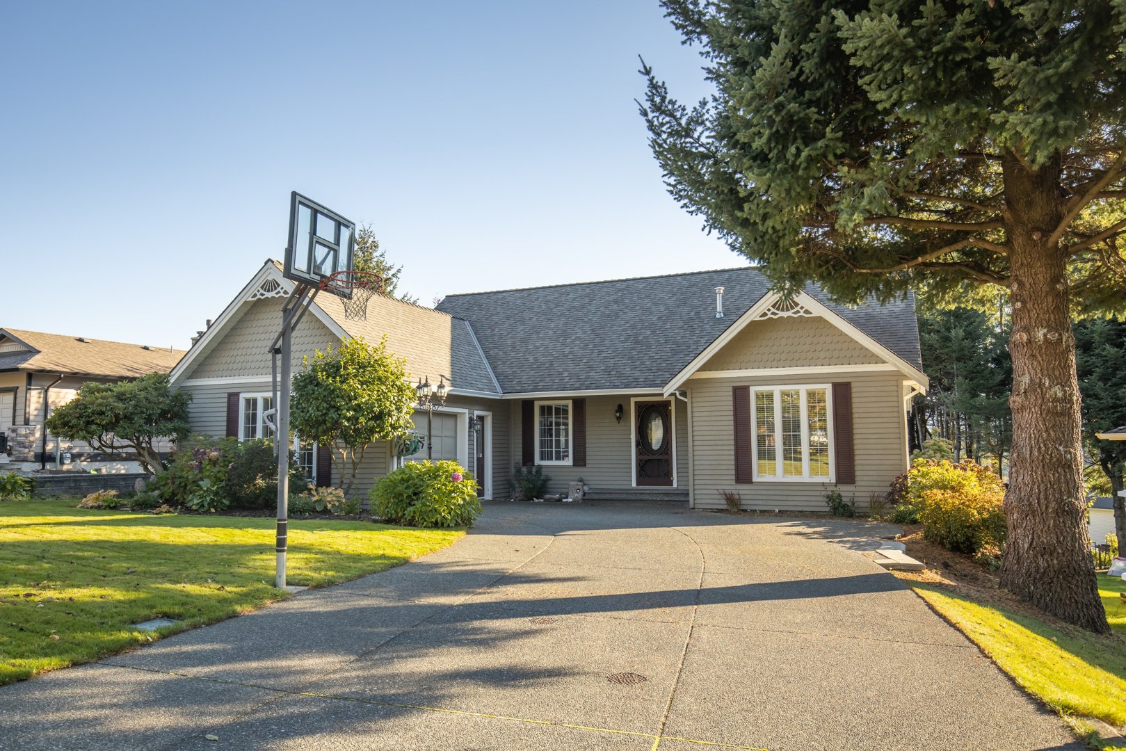 Innovative multi-level concrete driveway design for a sloped property